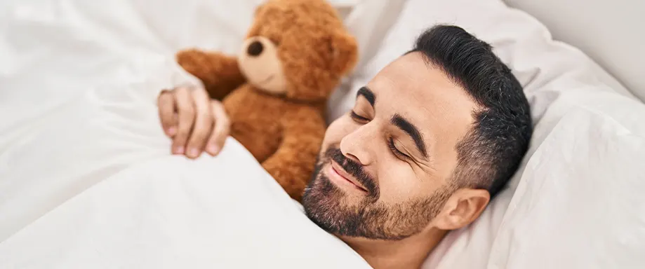 A man sleeping on a pillow