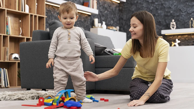 an image of a baby making the very first steps