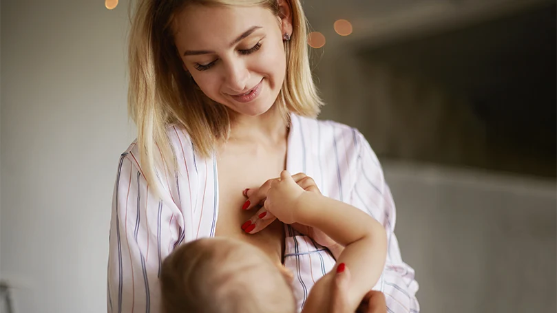 An image of a mother breastfeeding her baby.