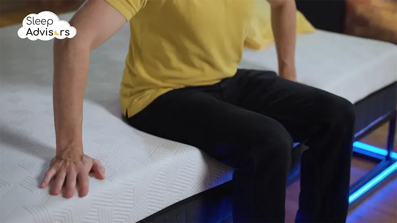 our presenter sitting on a Panda hybrid bamboo mattress