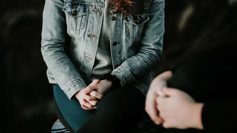 An image of a professional therapist aiding a patient